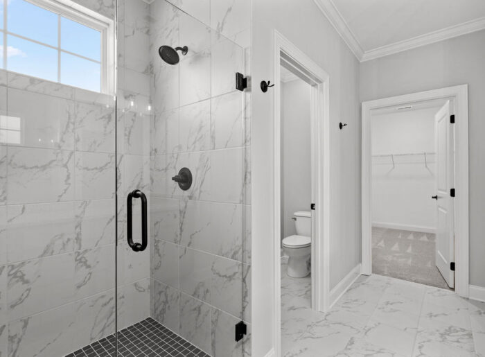 Designer shower in primary bath Pratt Home Builders