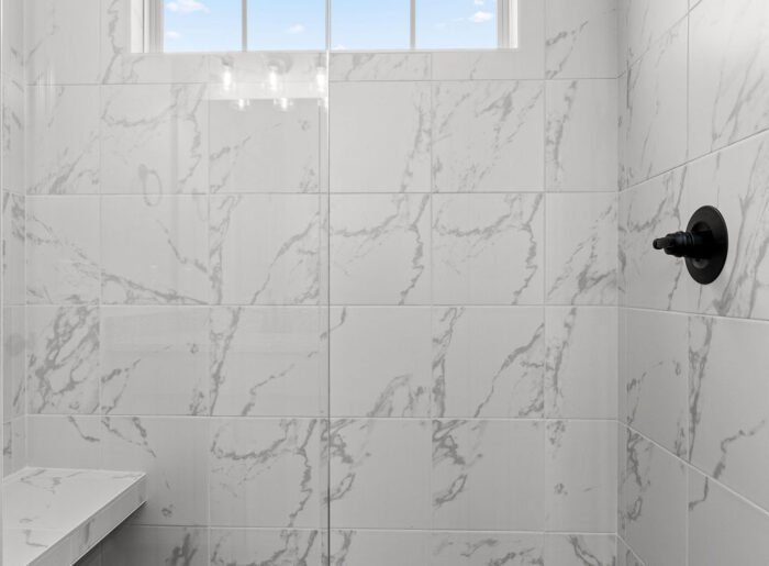 Expert and designer tile shower with seat Quick Move In home