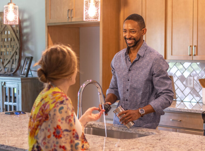Young couple. First time homeowners. New construction single level living.