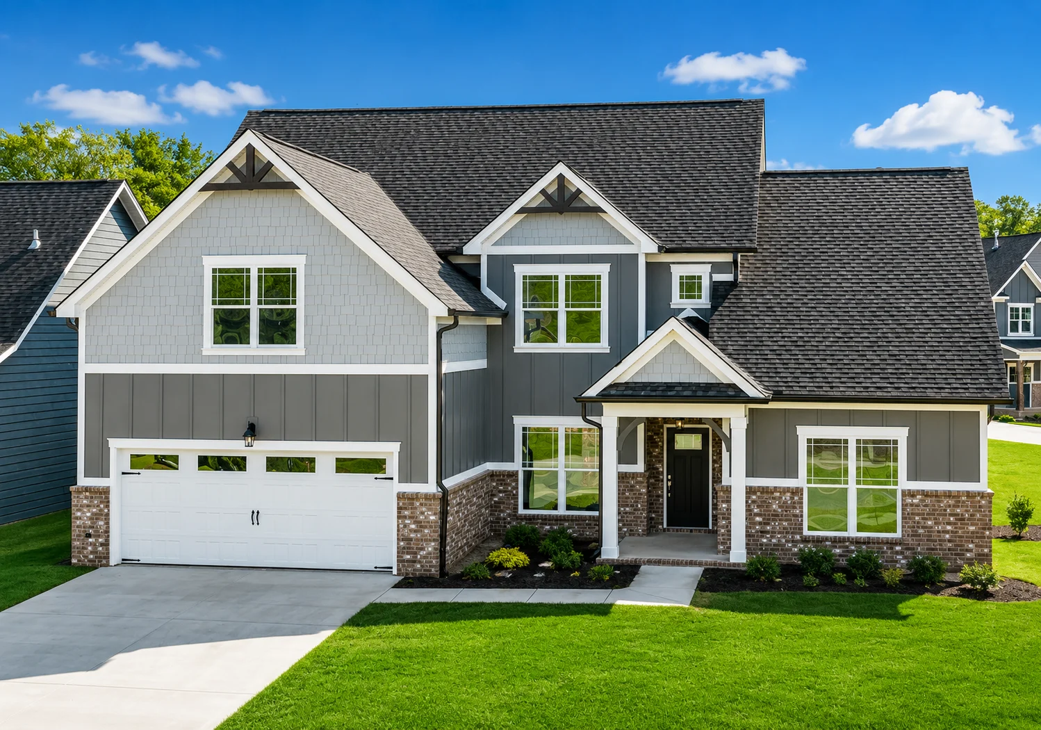 Azalea Hall-floor-plan-front-exterior-home-for-sale Stylish gray and brick house with a black roof and manicured lawn. Built by Pratt Home Builders in Chattanooga TN.