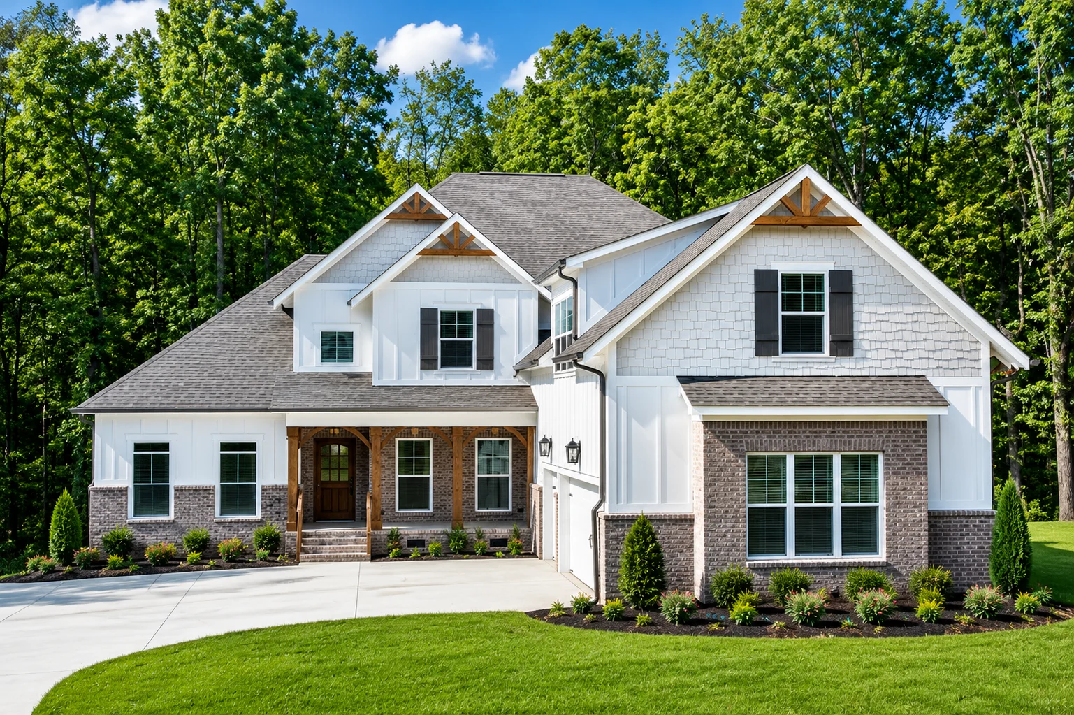 Cedar Bluff-floor-plan-front-exterior-home-for-sale Modern home with mixed siding, brick accents, and large windows, surrounded by trees. Built by Pratt Home Builders in Chattanooga TN.