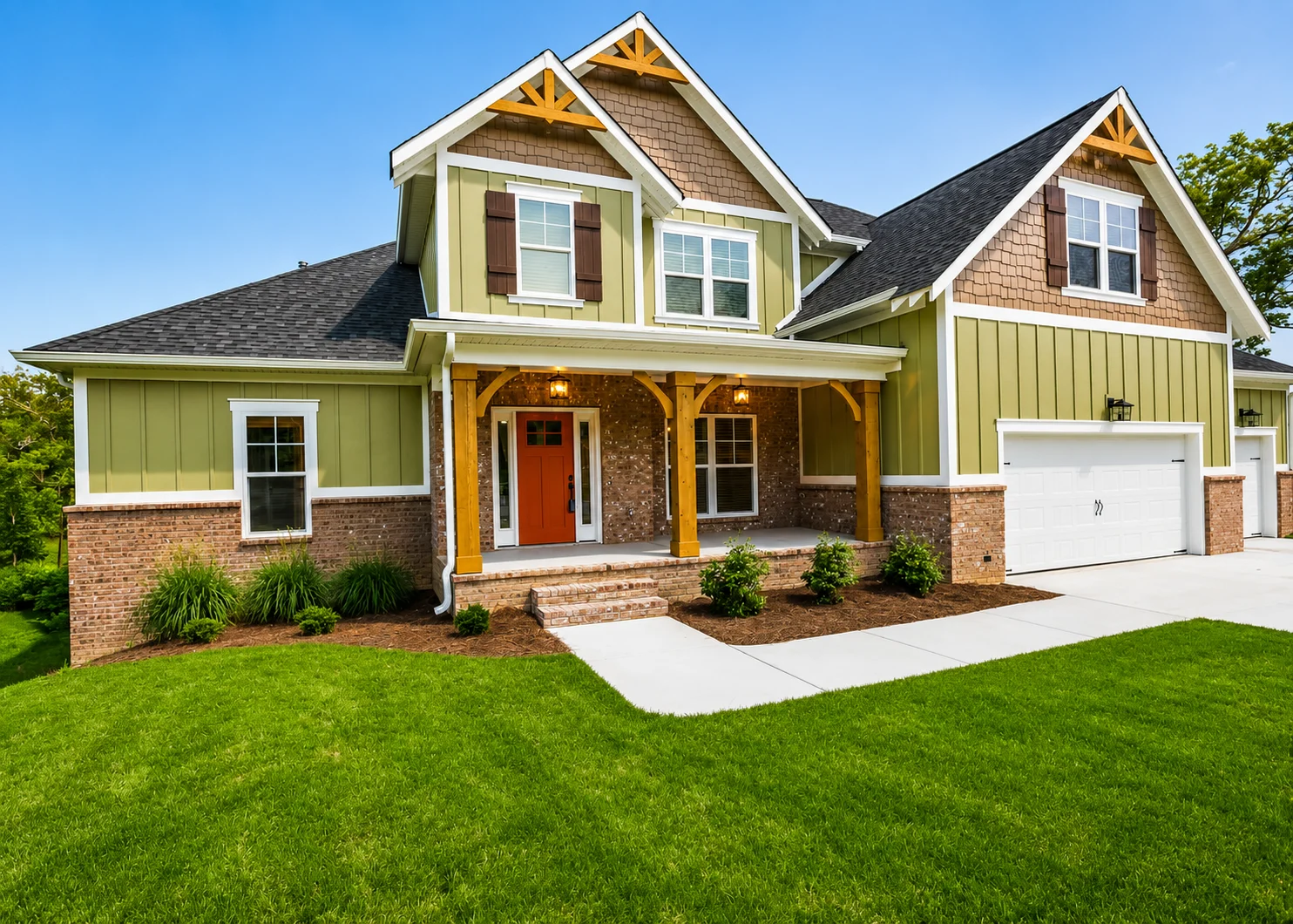 Cumberland Falls-floor-plan-front-exterior-home-for-sale Modern suburban home with red door, green siding, and a three-car garage, built by Pratt Home Builders in Chattanooga TN.