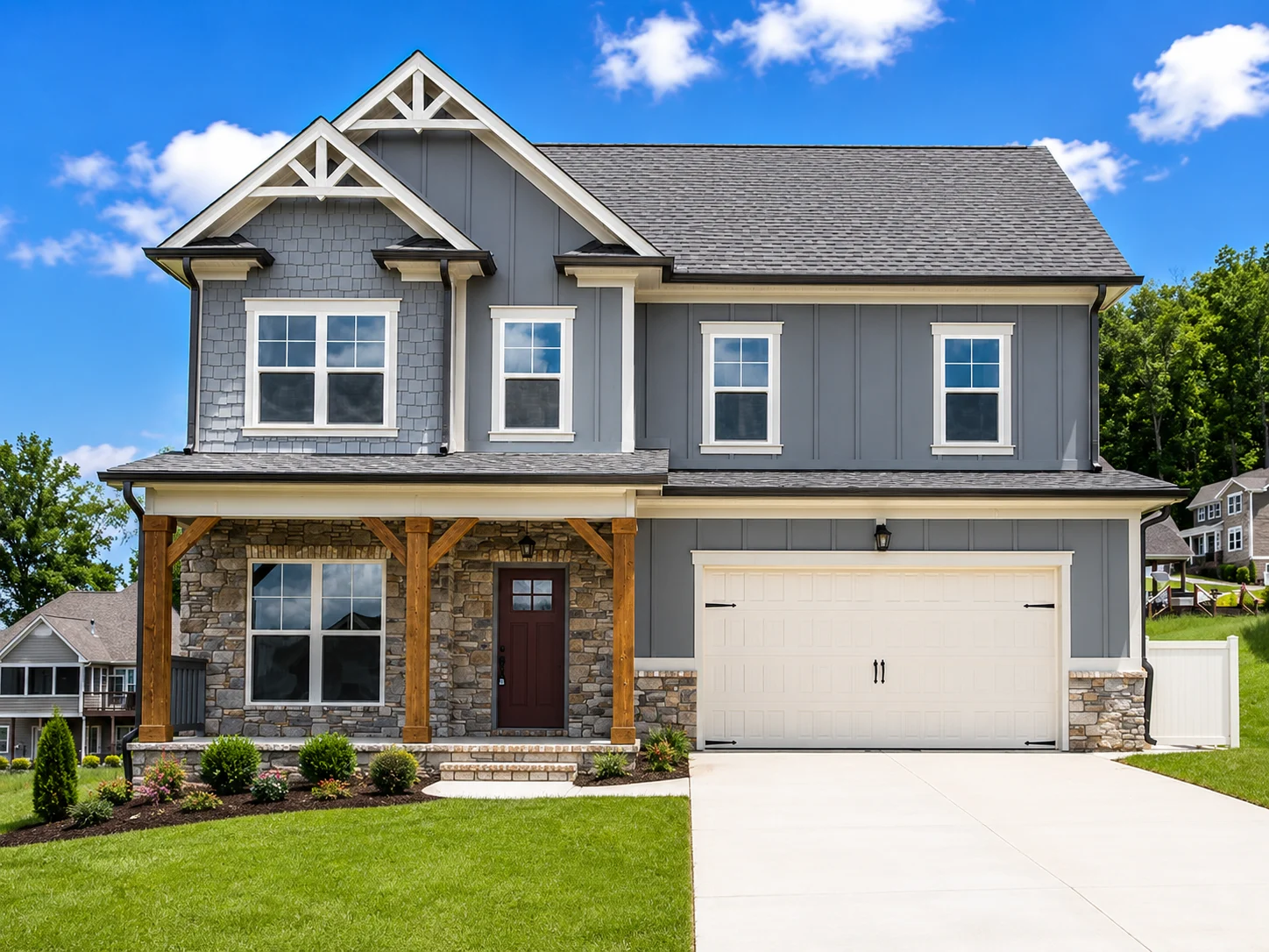 Deerfield-floor-plan-front-exterior-home-for-sale Modern two-story gray house with stone accents, front porch, and spacious garage by Pratt Home Builders in Chattanooga TN.