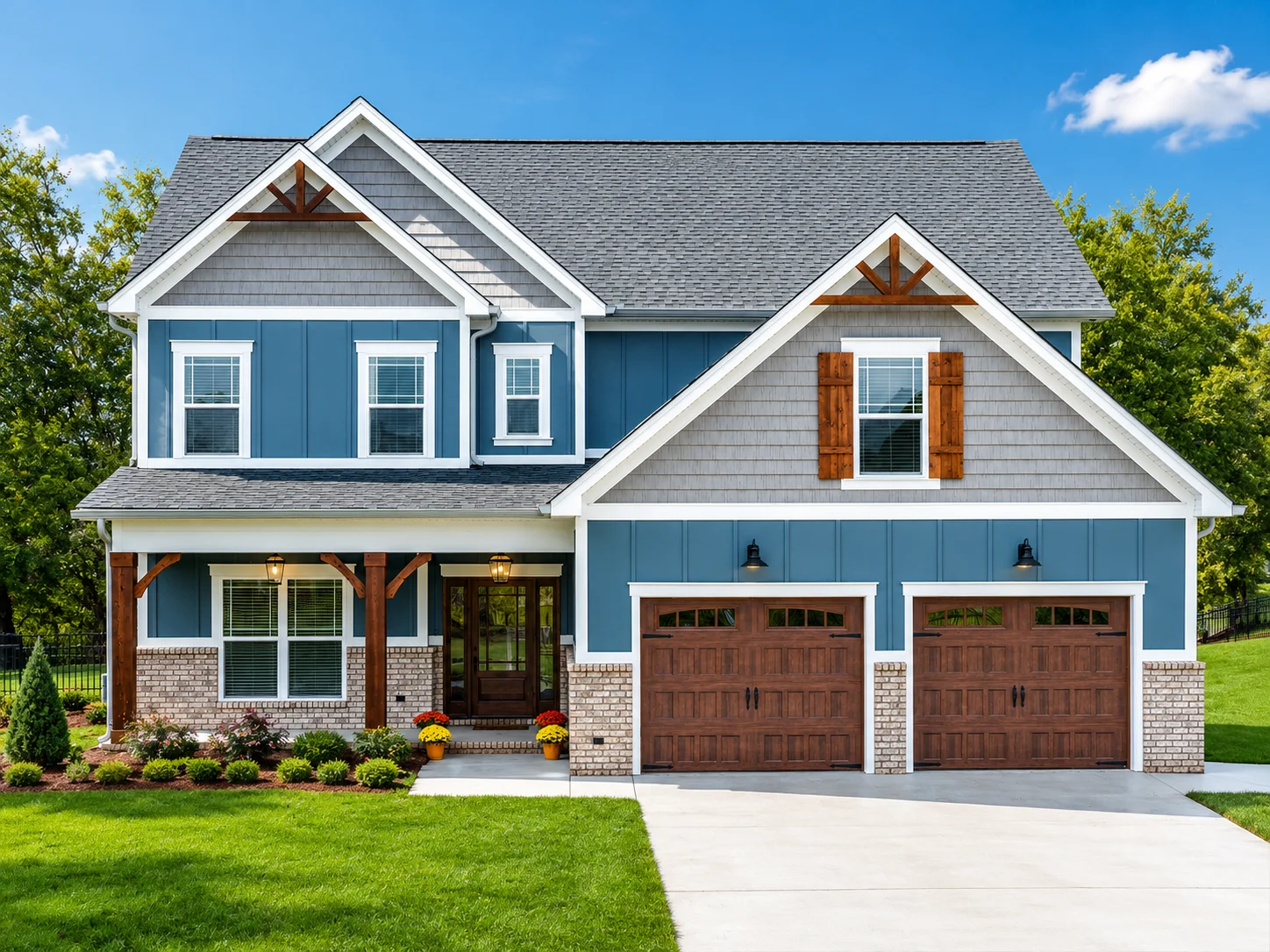 Peachtree Two-story blue house with brick accents, wooden shutters, and a manicured lawn. Built by Pratt Home Builders in Chattanooga, TN.
