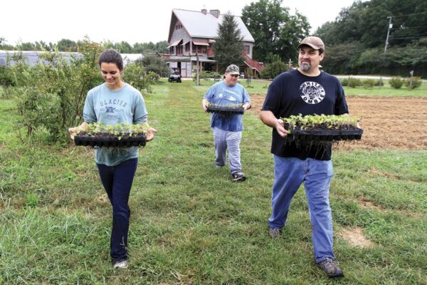 Pictured above are volunteers and farmers at Crabtree Farms
