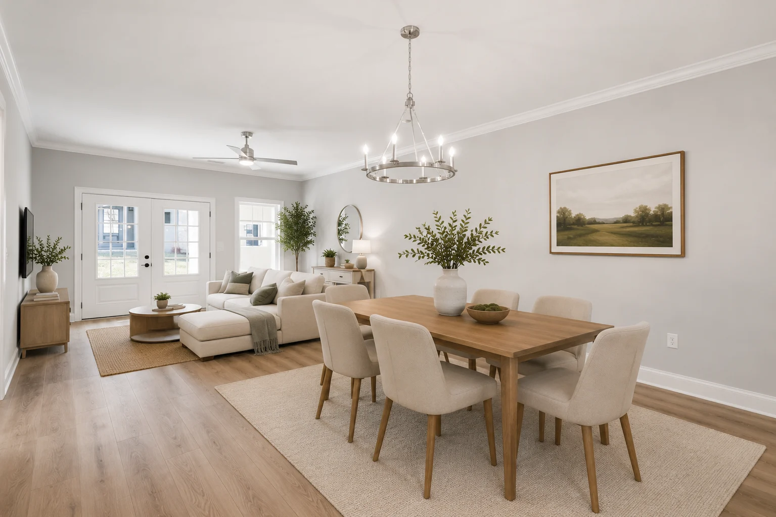 Open-concept living room and dining area with neutral tones, modern decor, and ample natural light. Featured by Pratt Home Builders in Chattanooga TN.