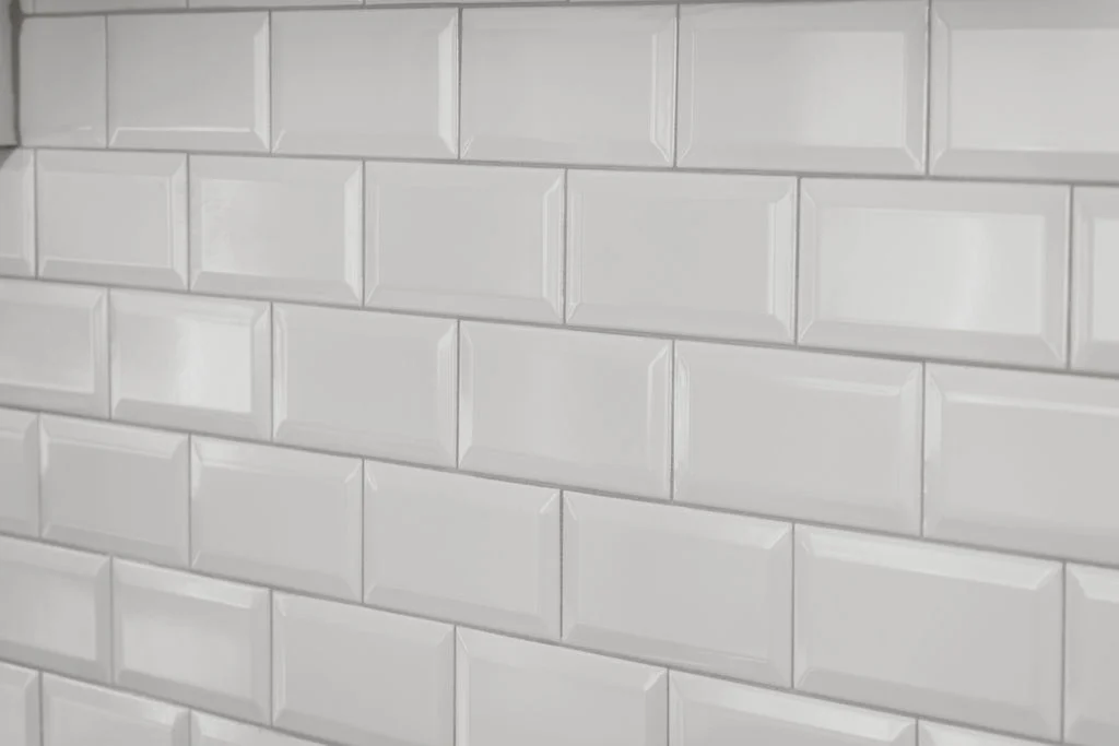 White subway tile wall in a sleek kitchen by Pratt Home Builders in Chattanooga TN.